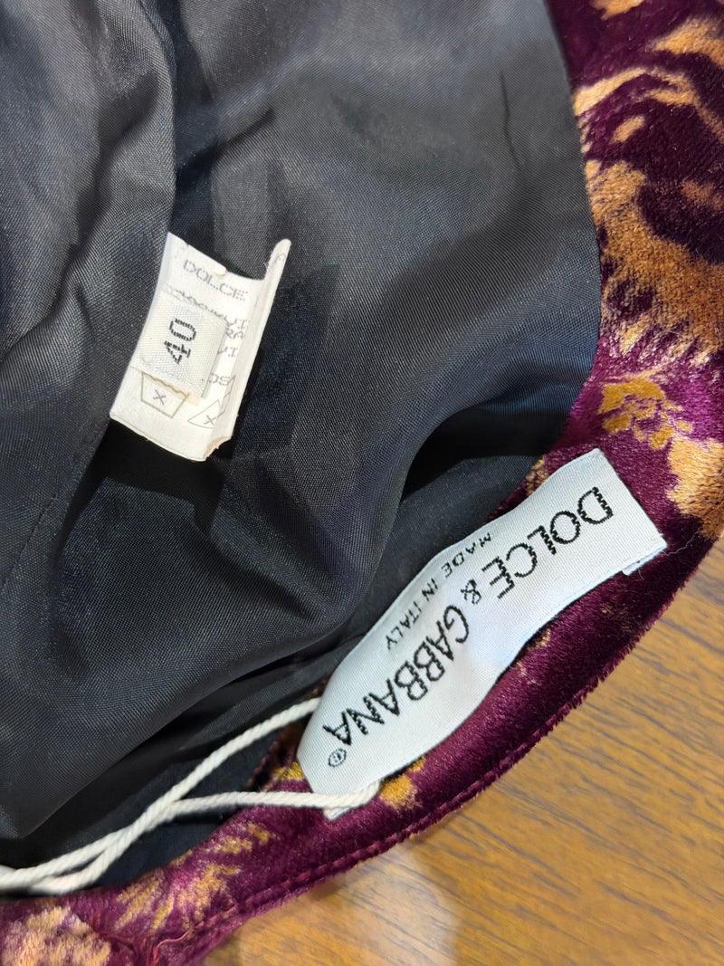 Burgundy and gold medallion print detail on lower panel of Dolce & Gabbana slip gown
