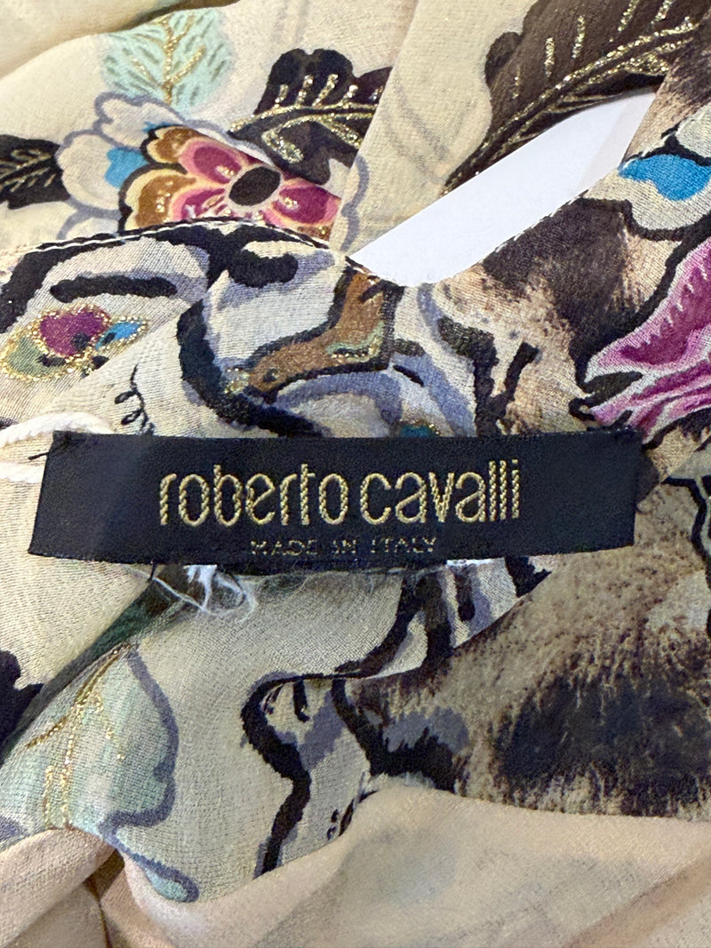 Hemline detail of Roberto Cavalli dress showing ruffled trim and leopard print accent on midi skirt