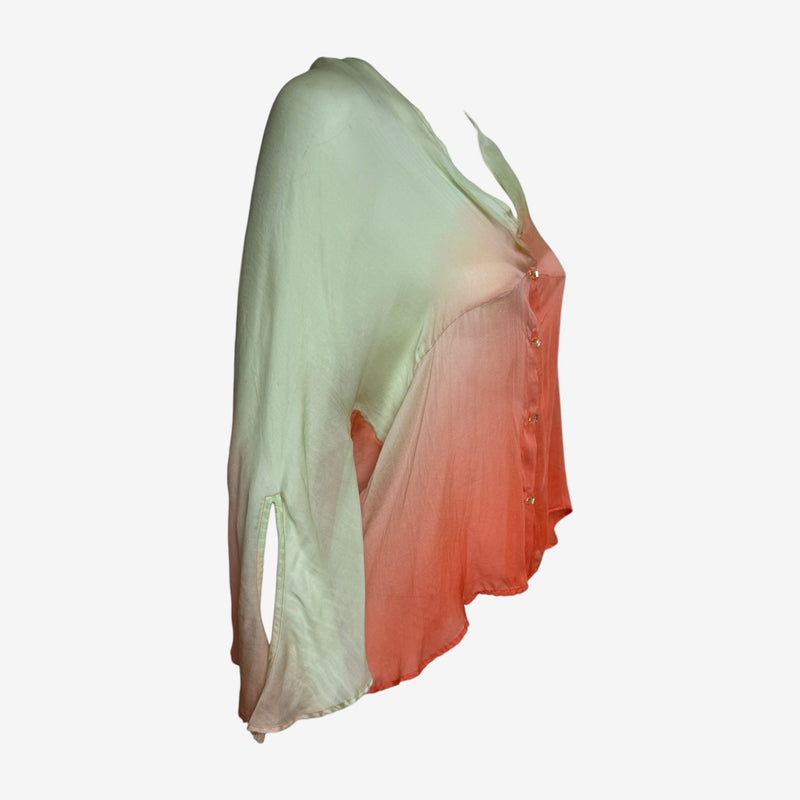 Gradient silk blouse detail, flowing panels and wide cuffs at sleeves