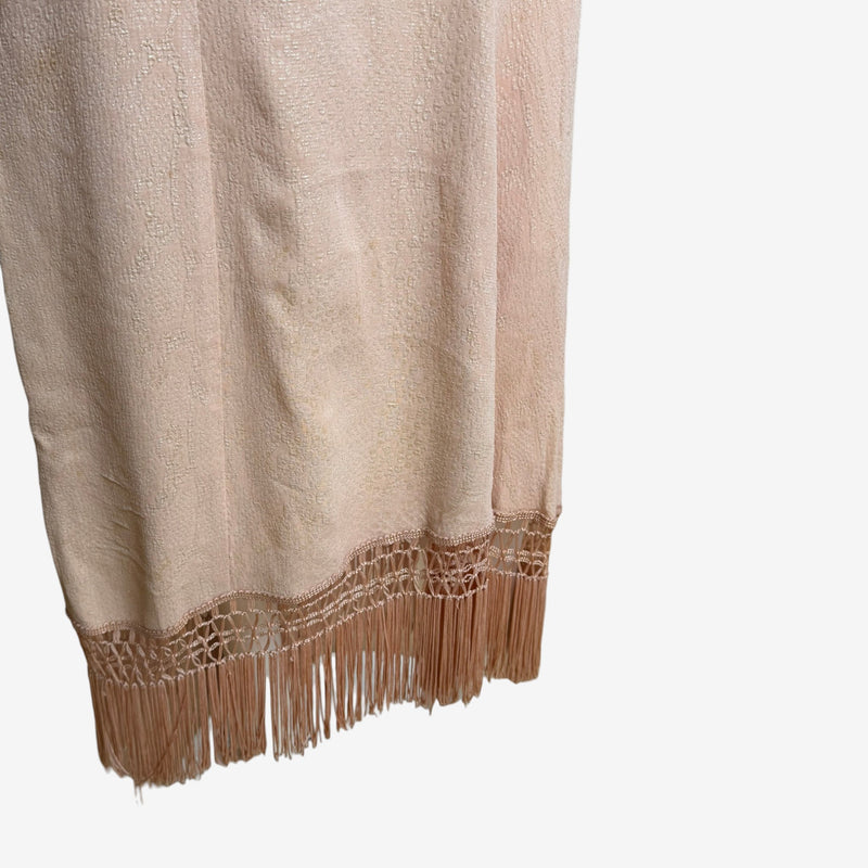 Deep V-neckline with scalloped embroidered edge and chain-detail spaghetti straps