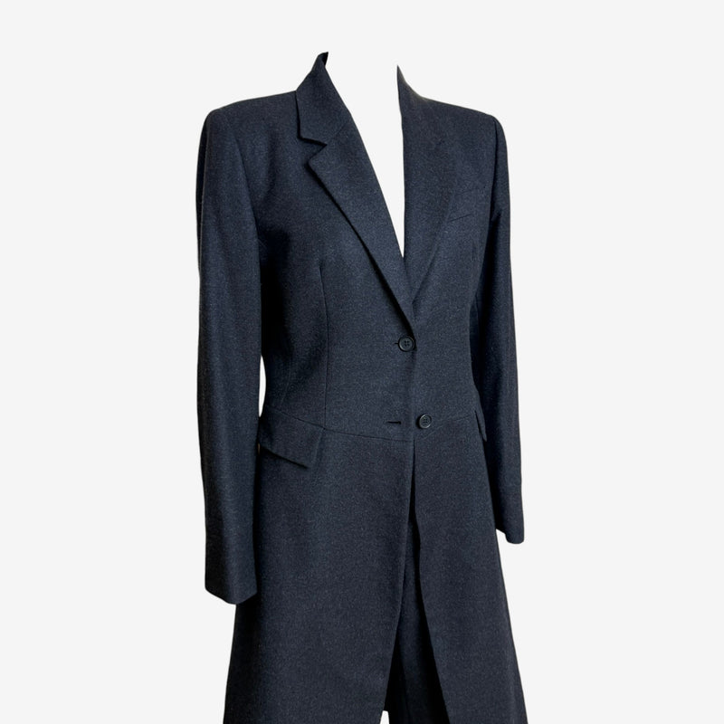 Alexander McQueen tailcoat rear view displaying fitted waist and full-length skirts
