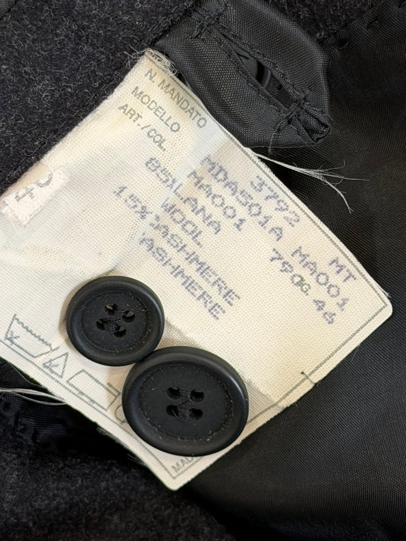 Tailcoat jacket interior showing silk lining with yellow accent trim throughout