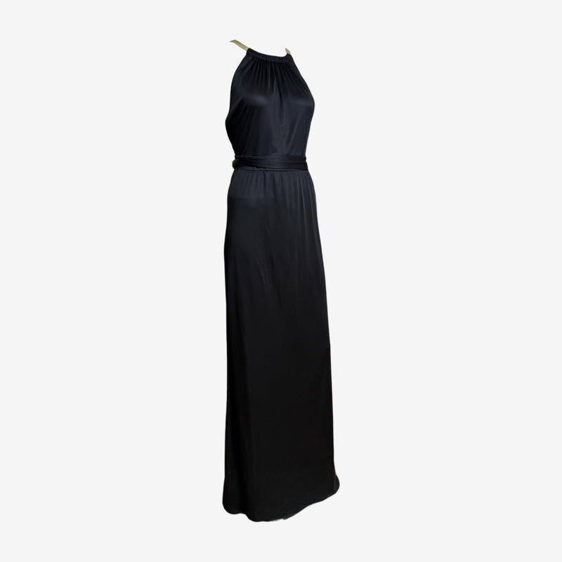 Black jersey halter gown by Gucci, gathered high neckline with gold-toned hardware straps