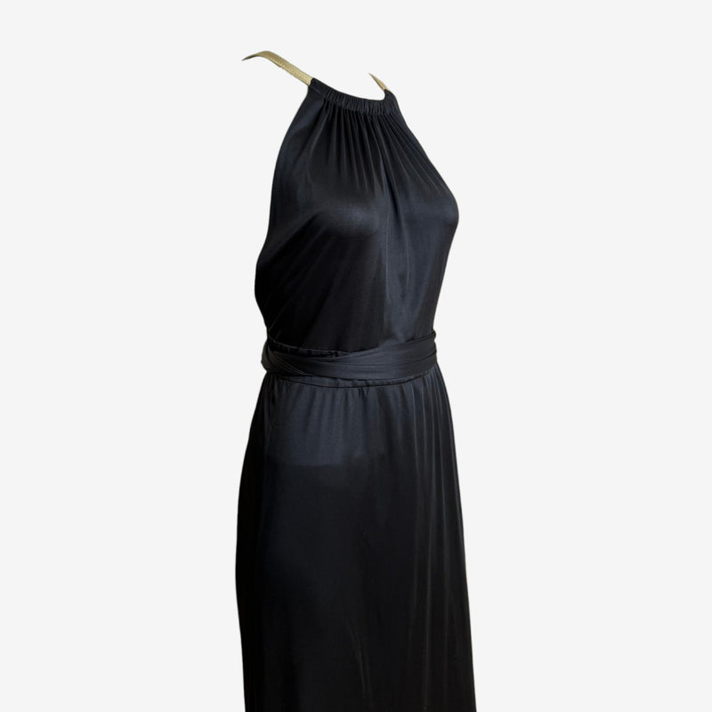 Black jersey halter gown by Gucci, side profile showing A-line flare and jersey sash belt