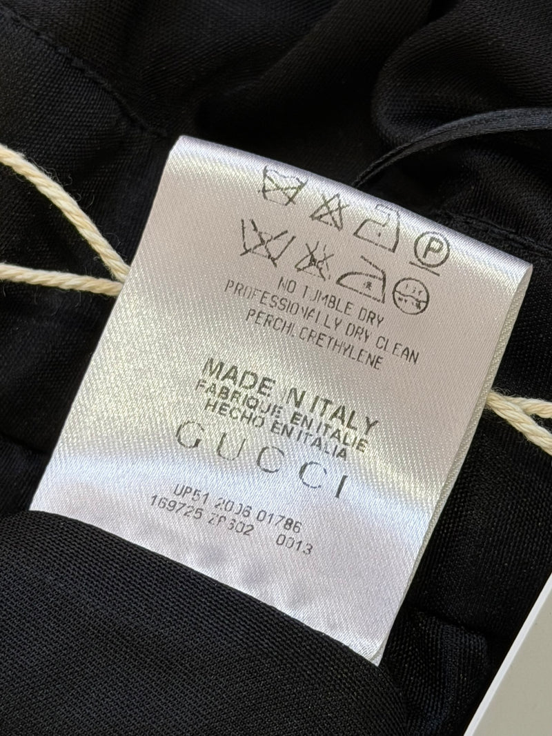 Black jersey halter gown by Gucci, detail of empire waistline and jersey sash belt