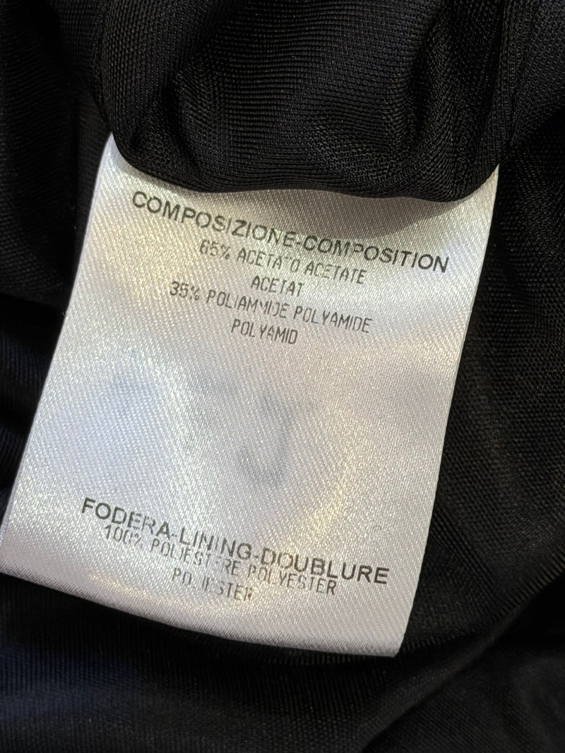 Black jersey halter gown by Gucci, full-length flat lay showing fluid drape and construction