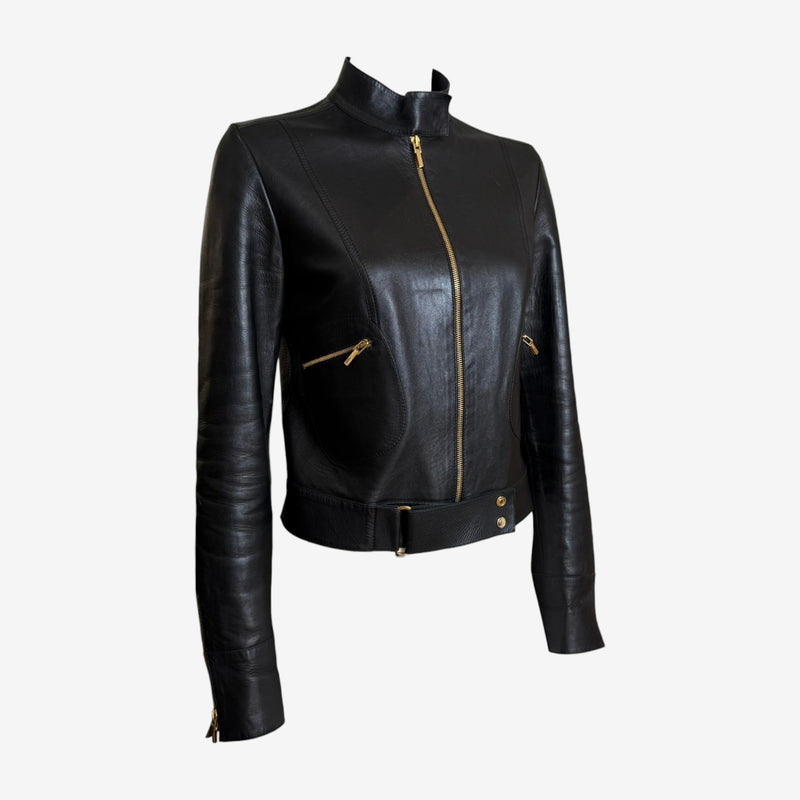 Black moto jacket detail showing quilted sleeve and zip cuff construction