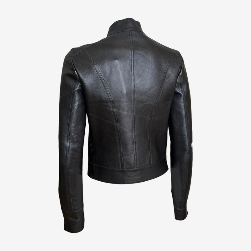 Black moto jacket side profile showing princess seaming and adjustable belt