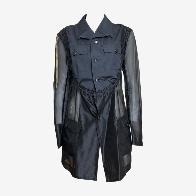 Navy cotton gabardine and sheer polyester hybrid military jacket by Comme des Garçons, front view with peaked lapels