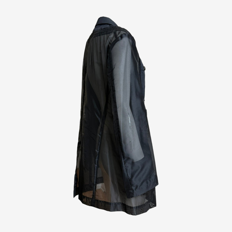 Comme des Garçons military jacket detail, rear view with transparent polyester back and lower patch pockets