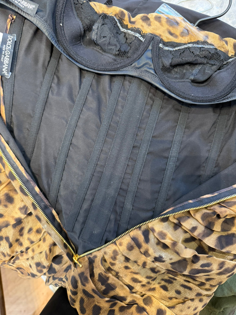 Hem detail of Dolce & Gabbana leopard bustier dress with black contrast binding