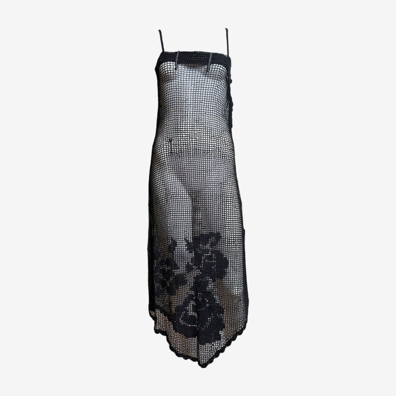 Black crochet mesh slip dress by Dolce & Gabbana, front view showing floral intarsia pattern at hem