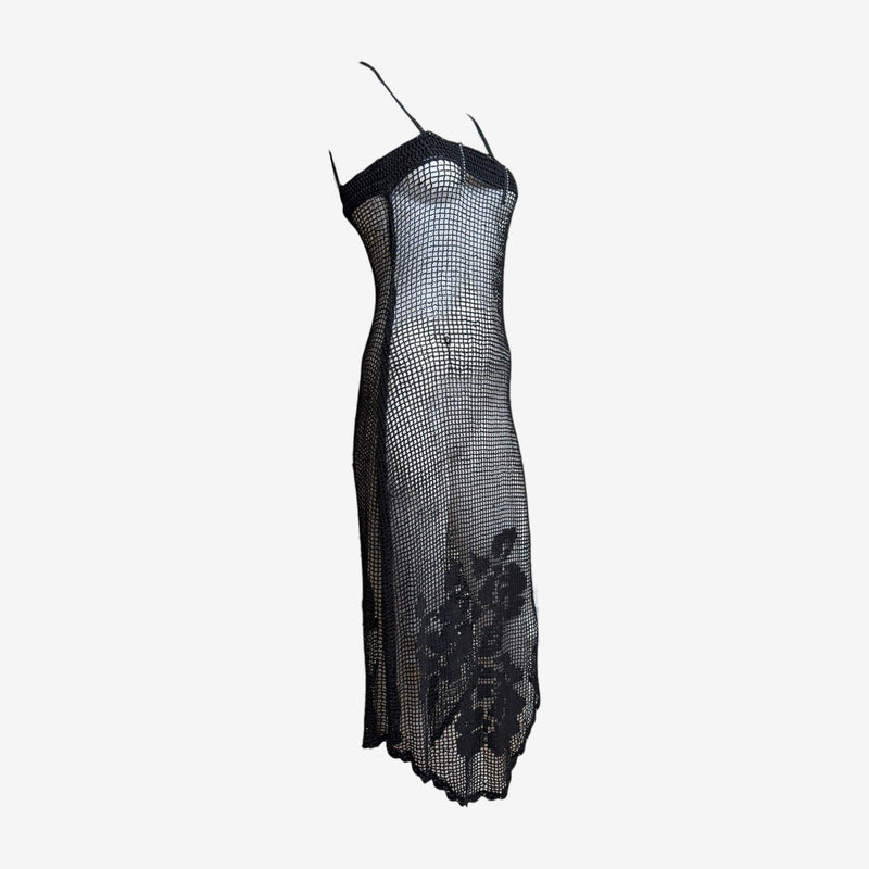 Black crochet mesh slip dress by Dolce & Gabbana, detail of shoulder strap and bustline