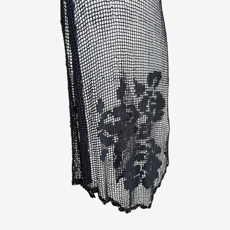 Black crochet mesh slip dress by Dolce & Gabbana, back view showing construction details