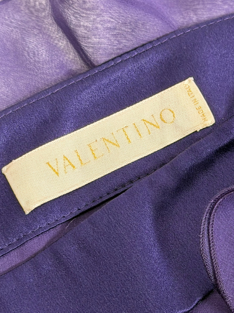 Purple silk satin gown by Valentino, full-length view of one-shoulder design with ruffled skirt
