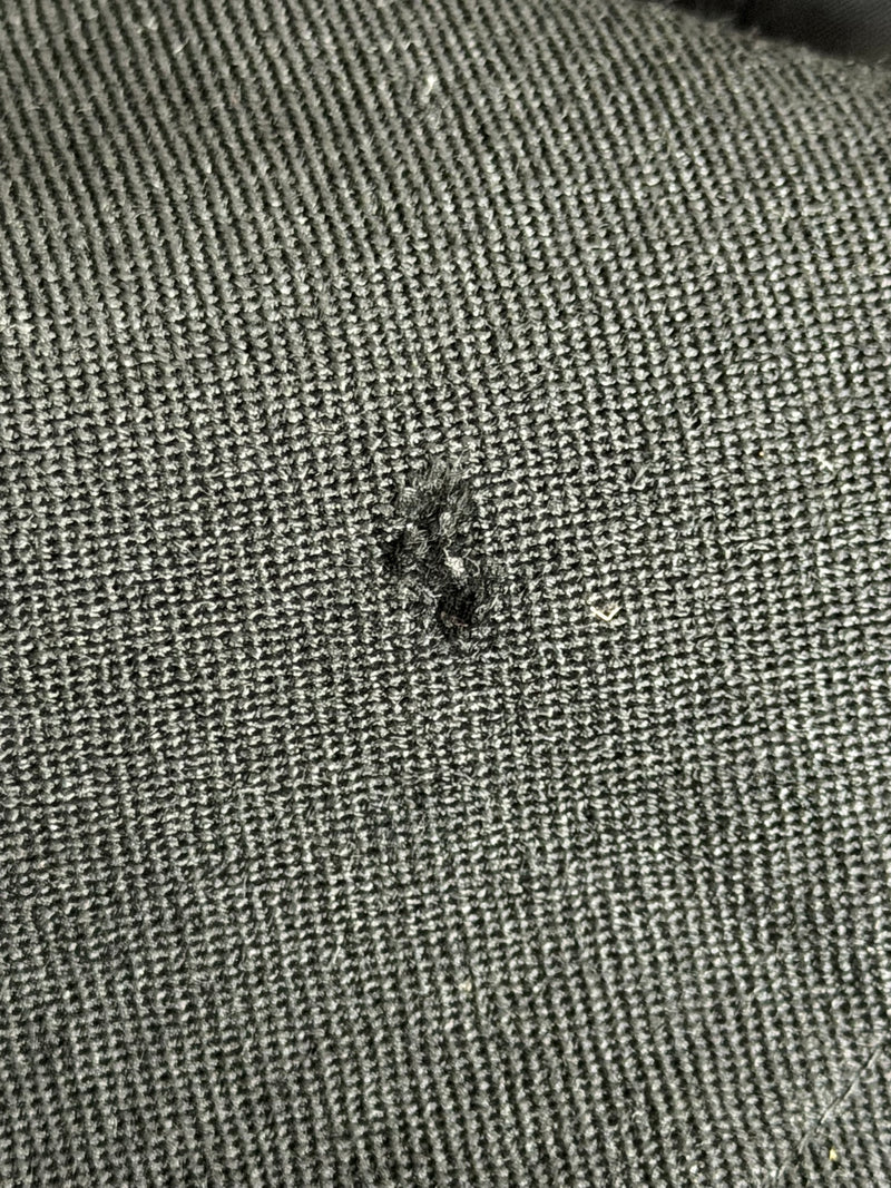 Black wool jacket by Yohji Yamamoto, hip pocket detail and belt buckle construction