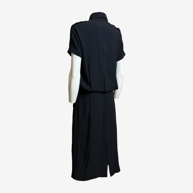 Black military shirt dress by Alexander McQueen, detail view of fitted pencil skirt construction