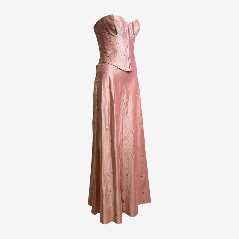 Back lace-up closure detail of dusty rose silk corset by Lolita Lempicka with silk ribbon ties