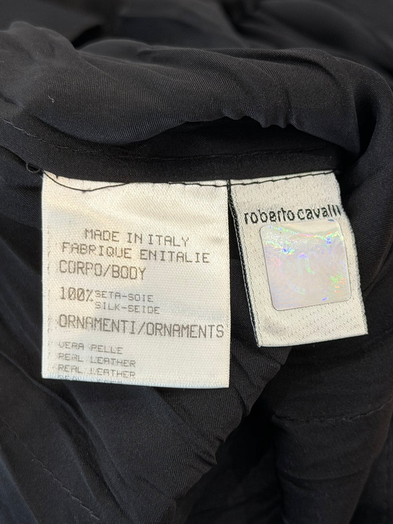 Cream silk shirt by Roberto Cavalli, cuff detail showing leather trim and button closure