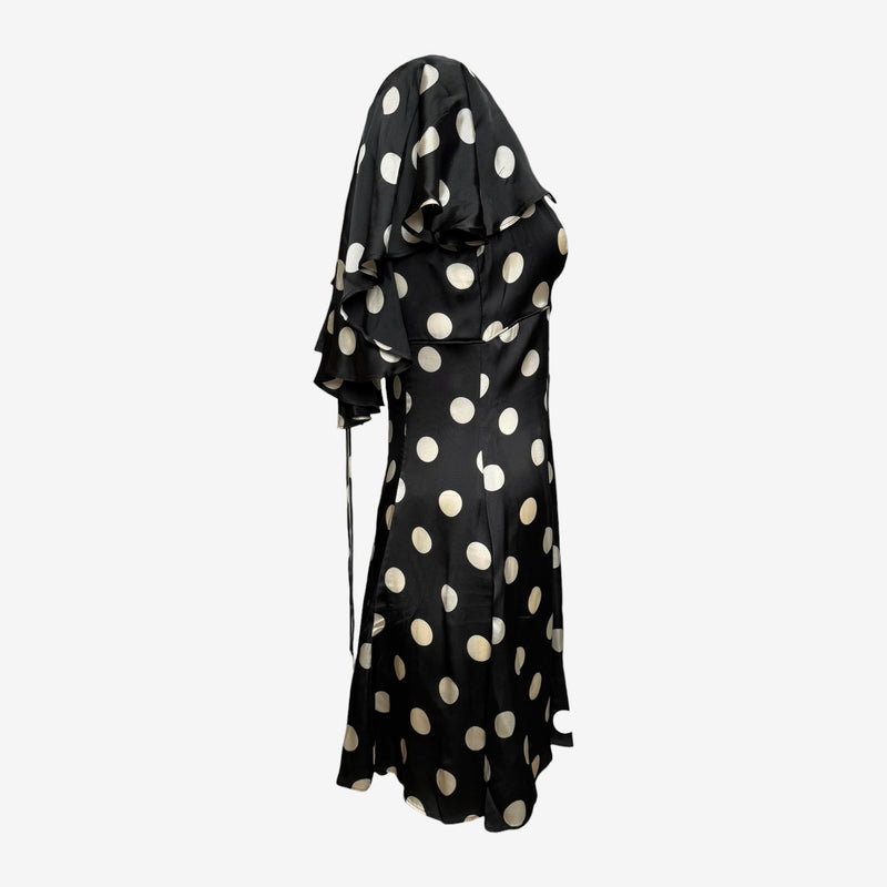 Back view of black polka dot Dolce & Gabbana dress with full-length zip closure