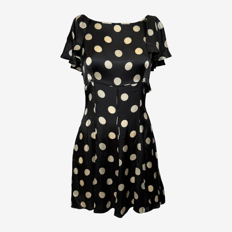 Black silk mini dress by Dolce & Gabbana with cream polka dots and dramatic ruffled flutter sleeves