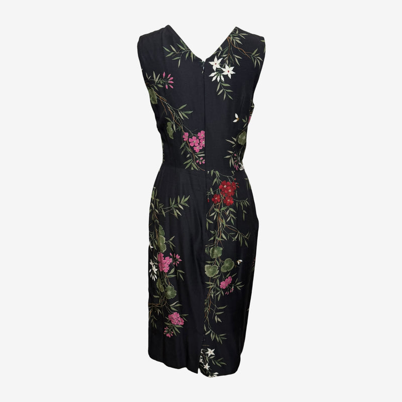 Black silk sheath dress by Dolce & Gabbana, detail of boat neckline and sleeveless armhole