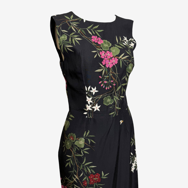 Black silk sheath dress by Dolce & Gabbana, back view showing zip closure from neckline