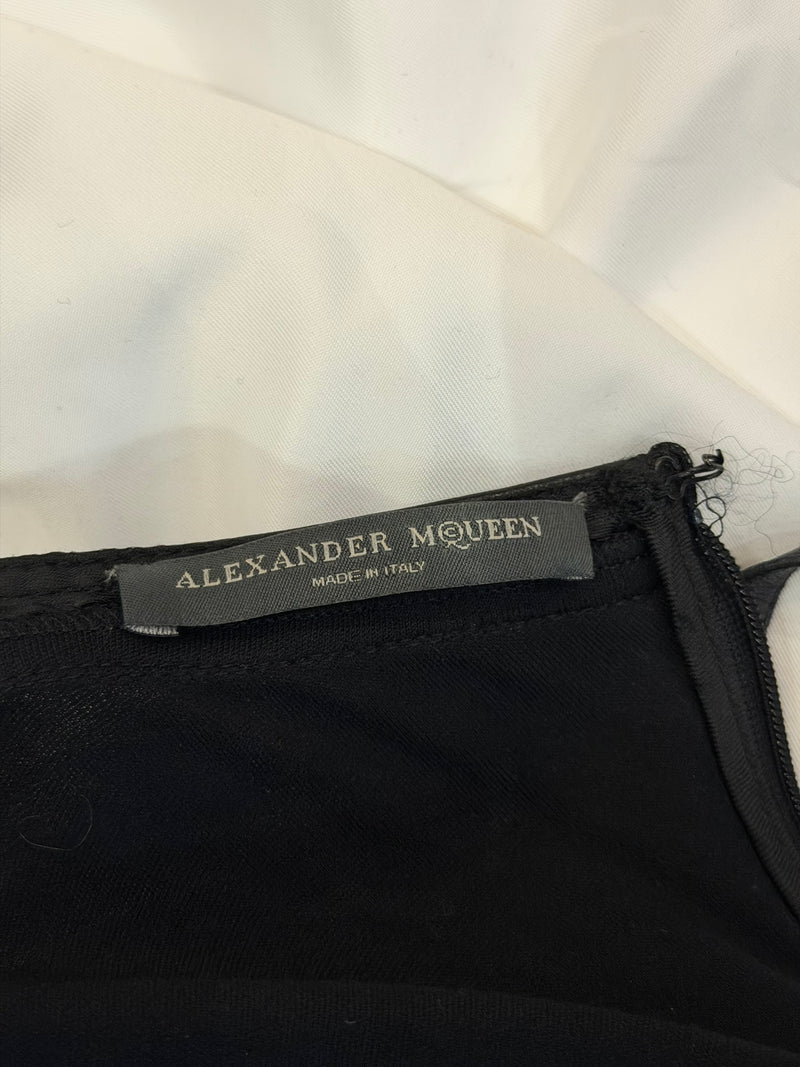 Black mid-length dress by Alexander McQueen with fitted bodice and slender straps