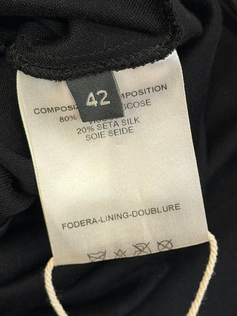 Alexander McQueen black dress, close-up of molded leather cup construction