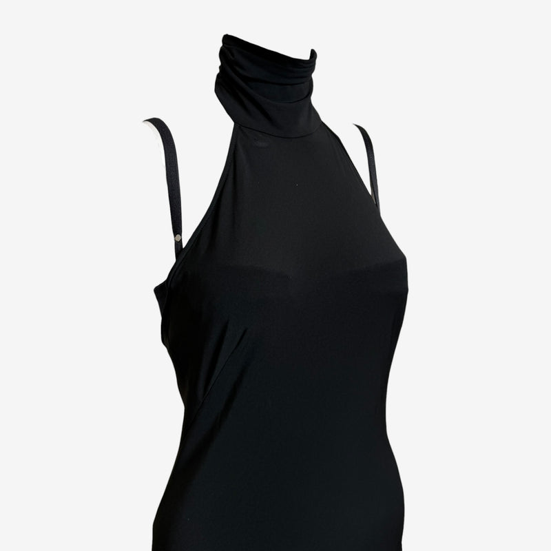 Black halter maxi dress by Dolce & Gabbana, side view of A-line silhouette and backless design