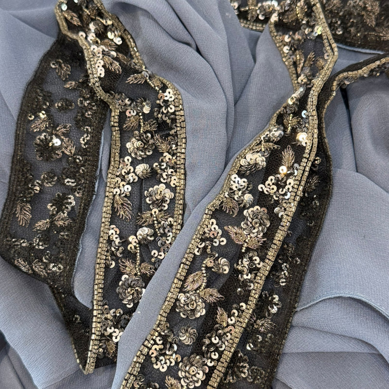 Back view of dusty blue Valentino dress with beaded shoulder straps and fitted silhouette