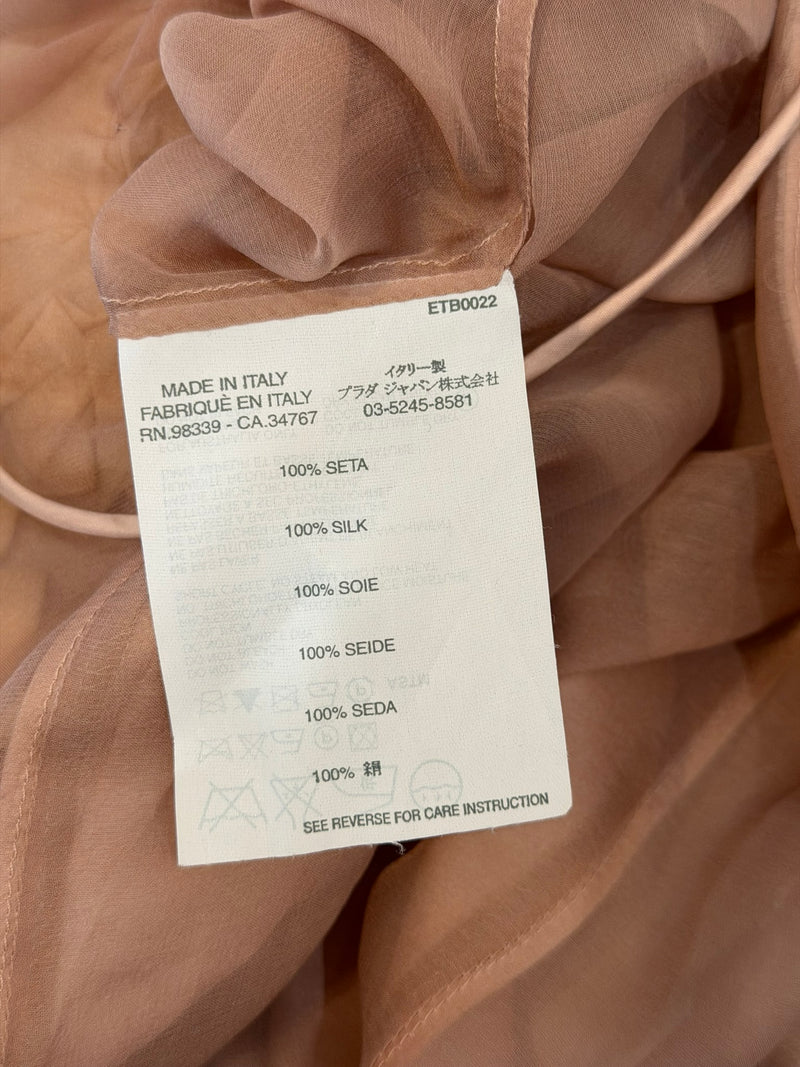 Full length view, Miu Miu blush silk camisole dress with draped chiffon swag and rose appliqués