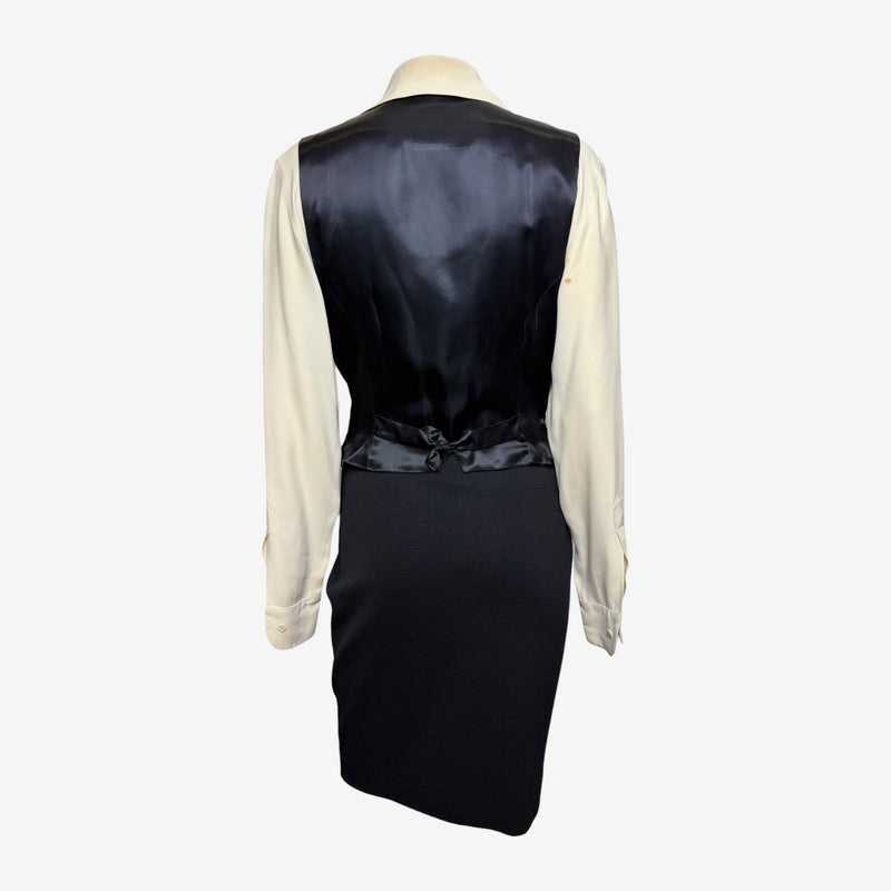 Blouse detail by Moschino Couture, French cuffs and concealed front placket buttons