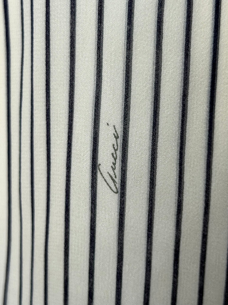White and black striped silk wrap blouse by Gucci, sleeve detail with button cuff