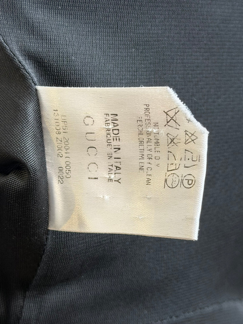 Black jersey halter gown by Gucci, layered detail of cutout construction