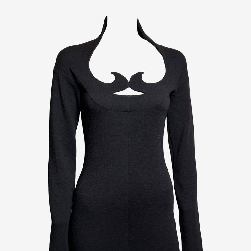 Black wool jersey cutout dress by Romeo Gigli, side view of fitted silhouette