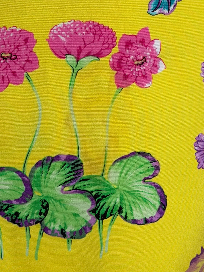 Yellow silk halter dress by Versace, close detail of botanical print with pansies and foliage