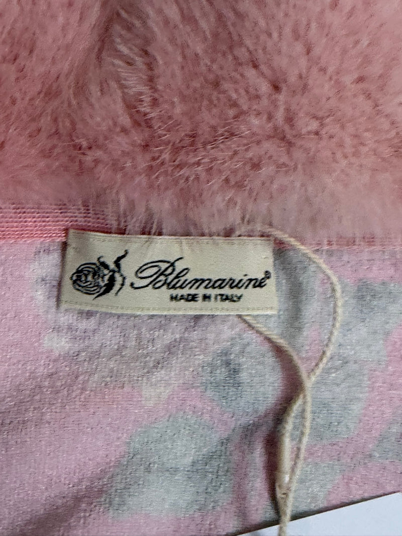 Pink cardigan with fur trim and floral skirt by Blumarine, ensemble worn on model