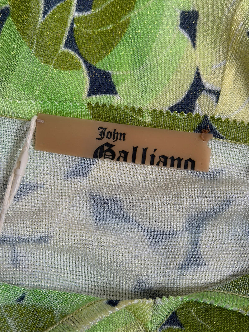 Green lotus viscose jersey dress by John Galliano showing body-skimming silhouette and ruffle construction