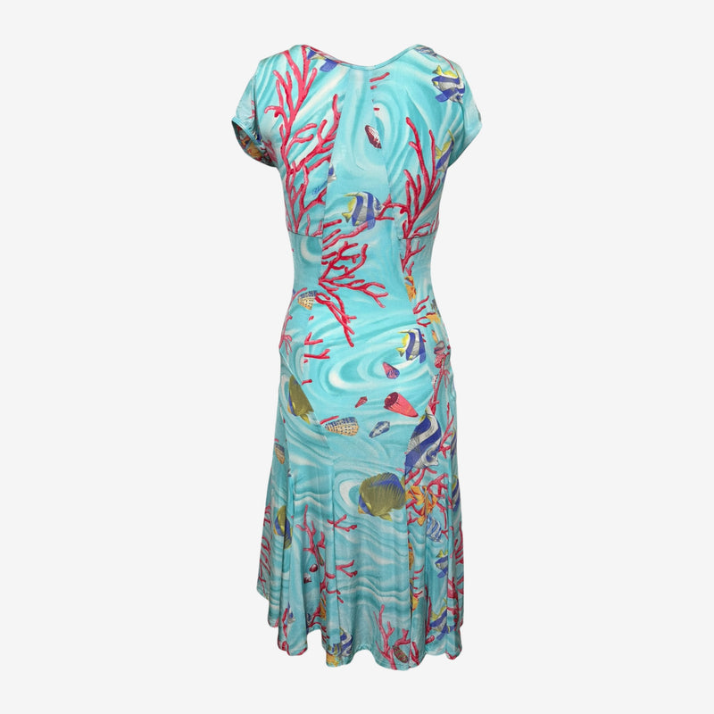 Blumarine dress back view showing curved asymmetrical panel construction