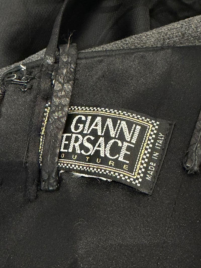 Black ruched mini dress by Gianni Versace, three-quarter view of gathered silhouette