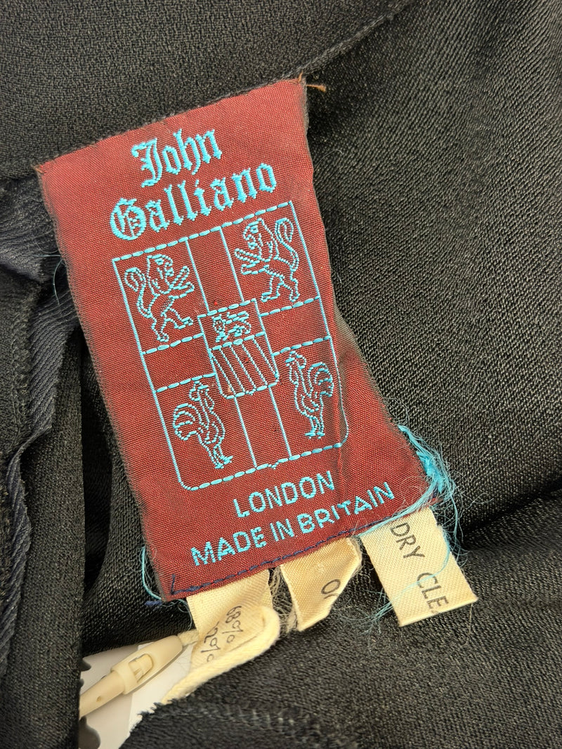 Black evening gown by John Galliano, interior garment construction and label detail