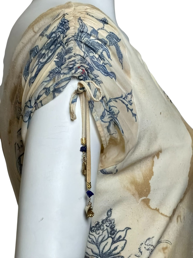 Close-up of Roberto Cavalli dress tattoo print detail