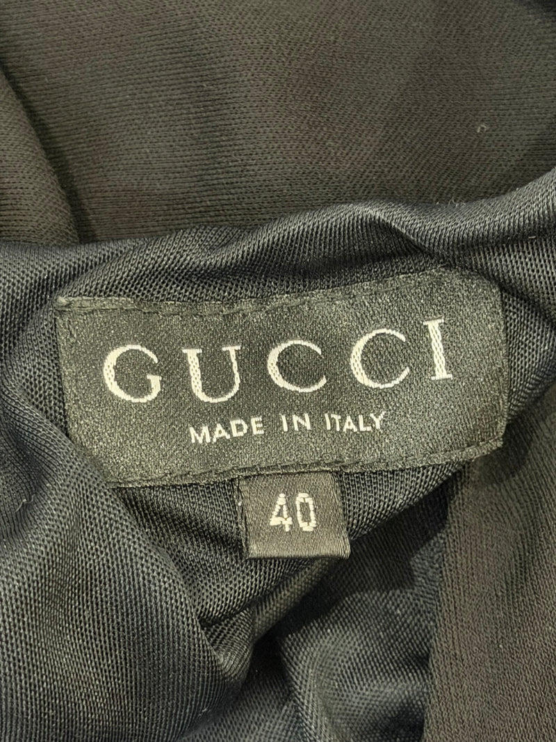 Black evening dress by Gucci Tom Ford, fabric detail showing fluid material and construction