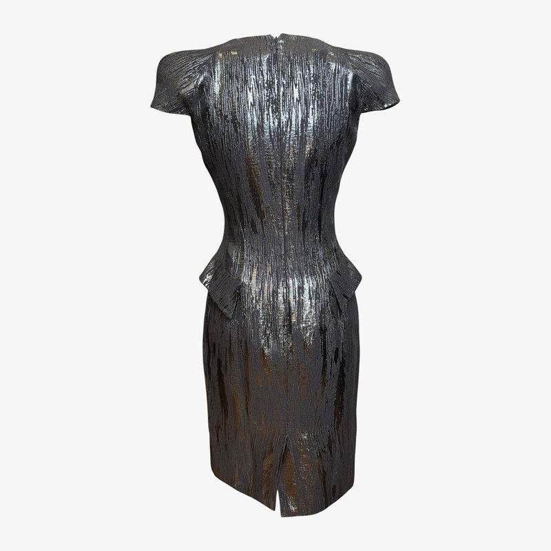 Silver metallic lamé dress by Alexander McQueen, side profile showing pencil skirt silhouette