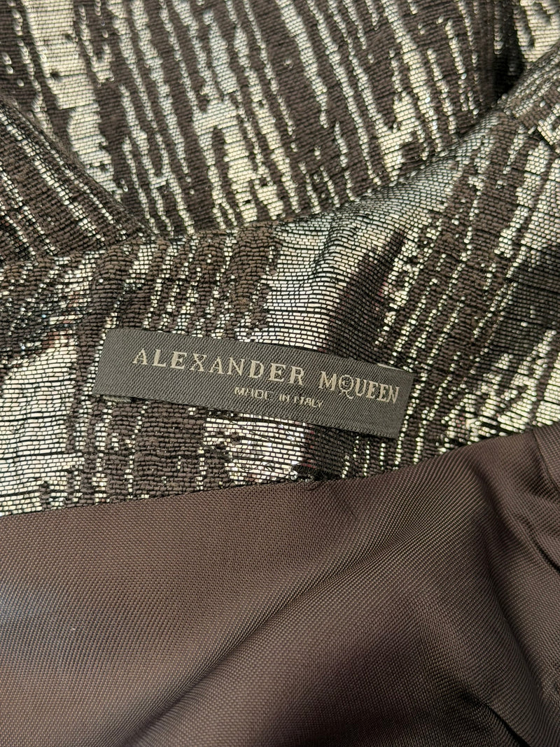 Silver metallic lamé dress by Alexander McQueen, close-up of cowl neckline and draped front