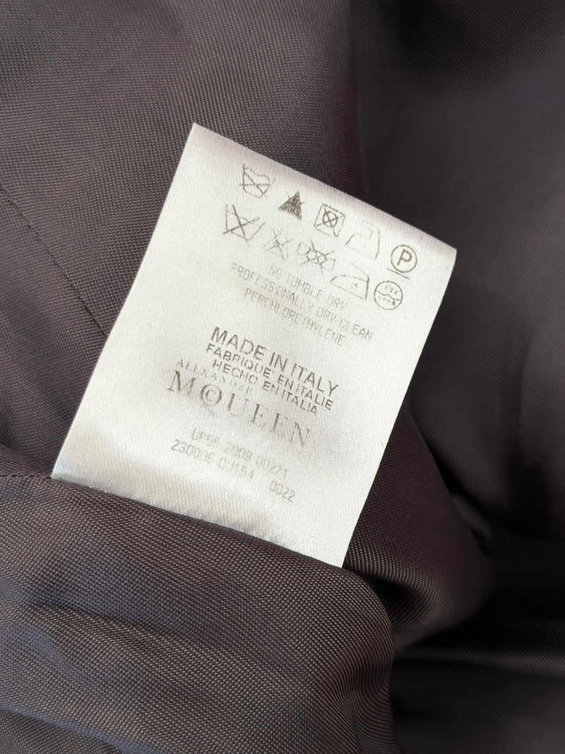 Silver metallic lamé dress by Alexander McQueen, hem detail with center back slit