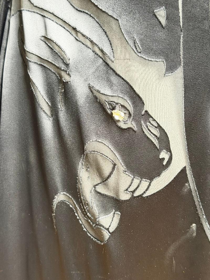Black silk satin one-shoulder gown by Valentino, hand-appliqué panther motifs, floor-length train