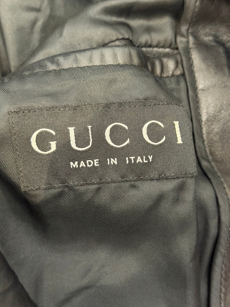 Black leather biker jacket by Gucci Tom Ford, sleeve detail with snap-button cuff