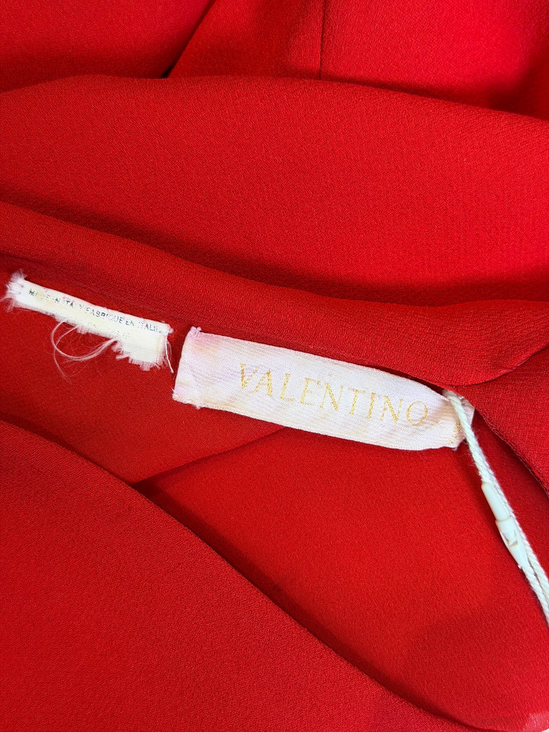 Red silk jersey gown by Valentino, back view showing asymmetric draping
